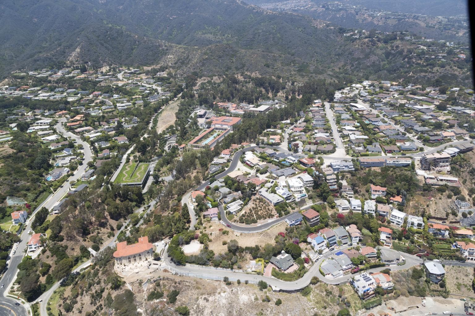 Pepperdine University stretches across a sunlit Malibu hillside.