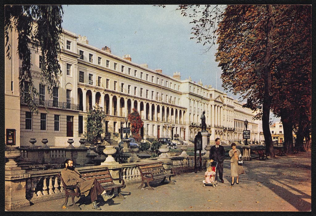 Shops, trees, and caryatid sculptures line a bustling postwar British high street.