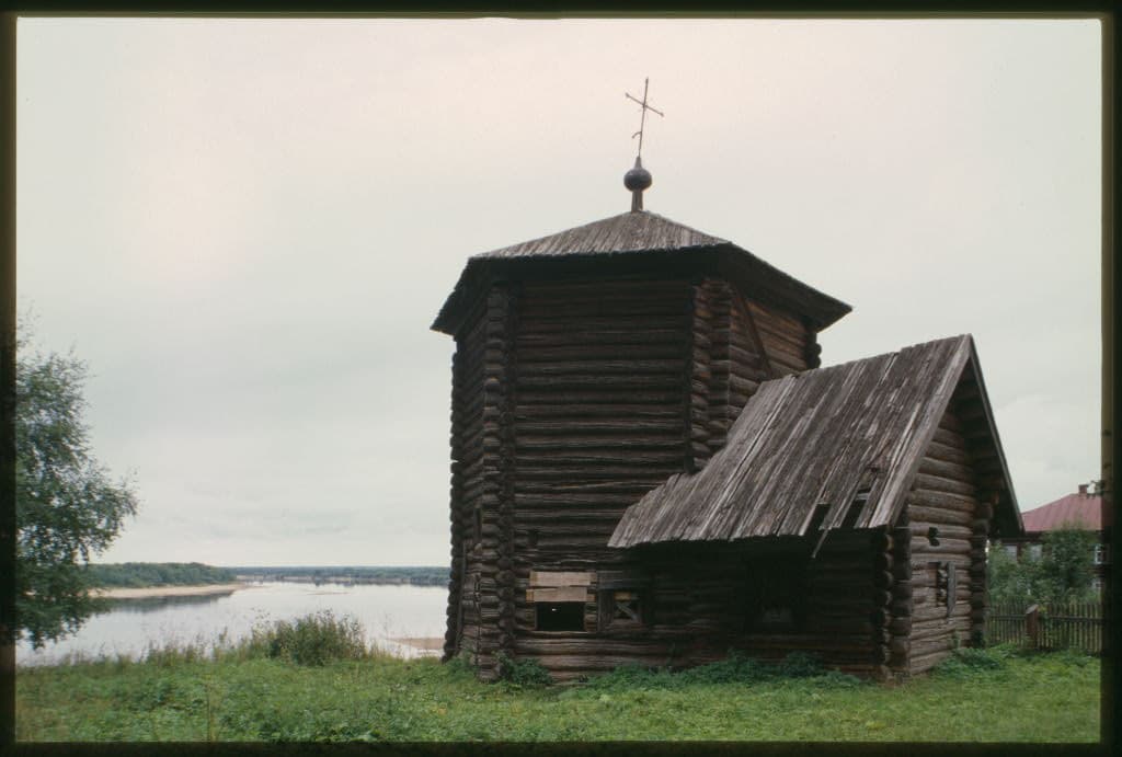 The 1617 Church of the Epiphany stands against a wide Russian river landscape.